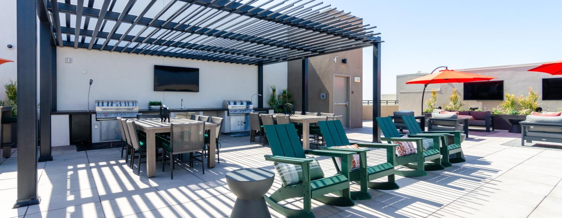 a patio with tables and chairs